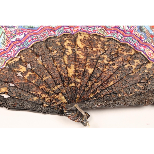 277 - 19th century Chinese folding Mandarin fan with carved tortoiseshell sticks. Fourteen leaves painted ... 