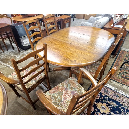 618 - Ercol extending dining table with six chairs