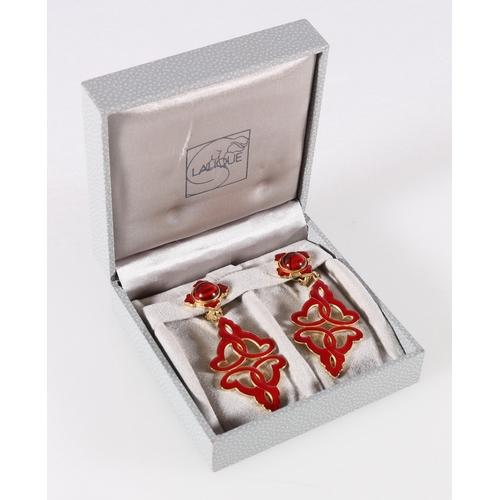 580 - Pair of Lalique red enamelled yellow metal pendant earrings, in original box.