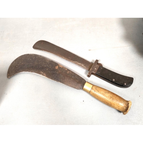 216 - WW2. USAF folding survival machete and a British military billhook dated 1942. (2)