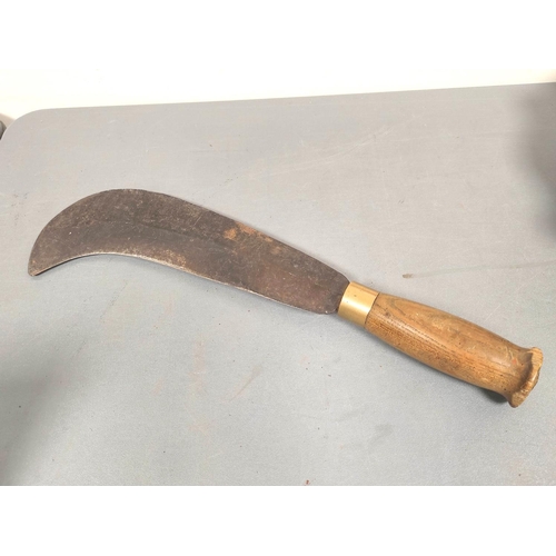 216 - WW2. USAF folding survival machete and a British military billhook dated 1942. (2)