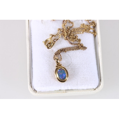 557 - 18ct gold mounted opal pendant, on gilt metal chain.