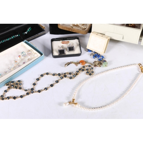 561 - Costume jewellery to include Monet necklace, faux pearls, watches, etc. 