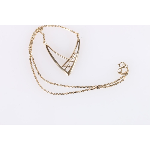 562 - 9ct gold stylised wishbone pendant, on 9ct gold chain, 6.5g.