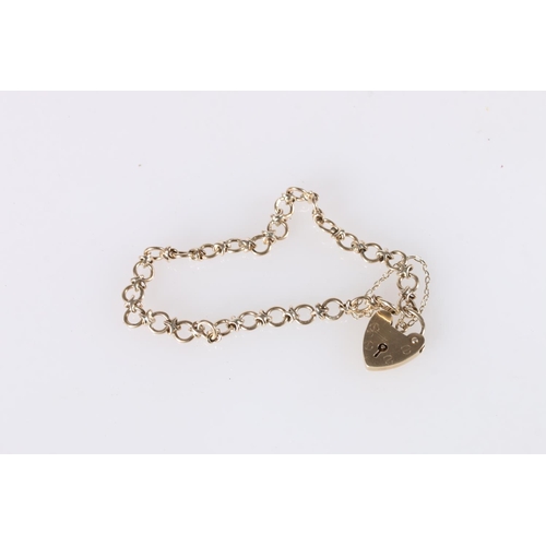 563 - 9ct gold bracelet, with heart padlock, 10.3g.