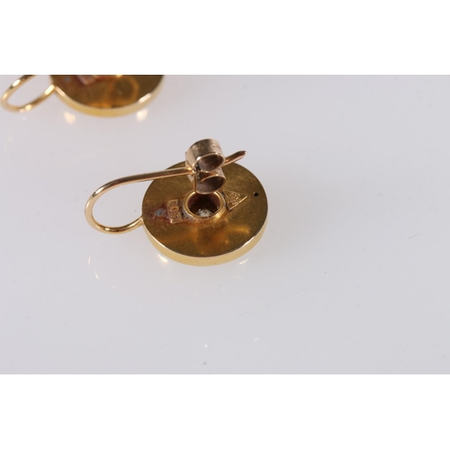 576 - Pair of 15ct gold earrings with diamond chips to centre, 1.3cm, 2.7g.