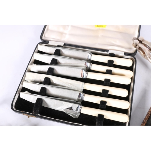 594 - Twelve O Gallia silver plated knife rests  of classical design, 3 x 8 x 4cm, also boxed knives, salt... 