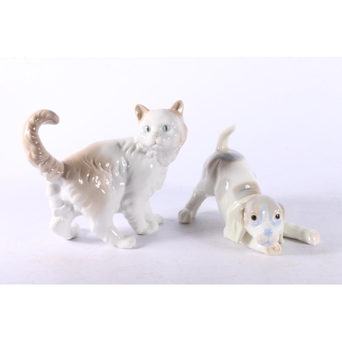 11 - Lladro figurines to include #5123 Swan, #1143 Polar Bear group, a Nao model of a cat, and another.  ... 