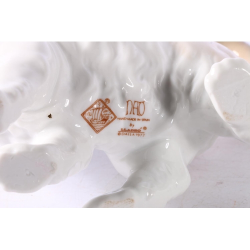 11 - Lladro figurines to include #5123 Swan, #1143 Polar Bear group, a Nao model of a cat, and another.  ... 