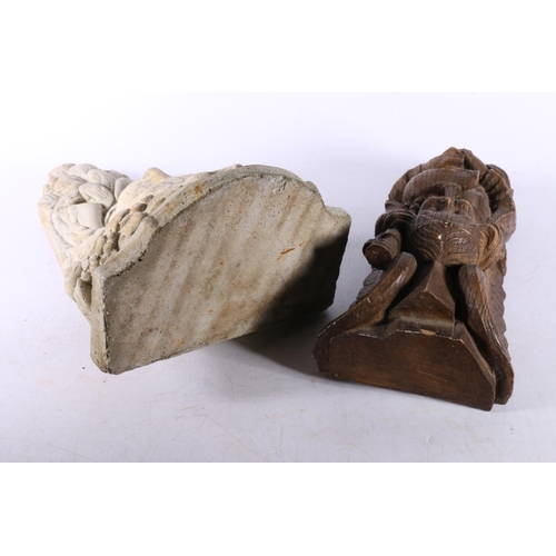 21 - Resin corbel in the form of a young man playing pipes, 23cm high, and a cast concrete wall sconce, 2... 