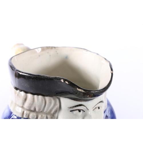 24 - Antique style toby jug, 14cm high, and a Lord Wellington and General Hill relief decorated jug.