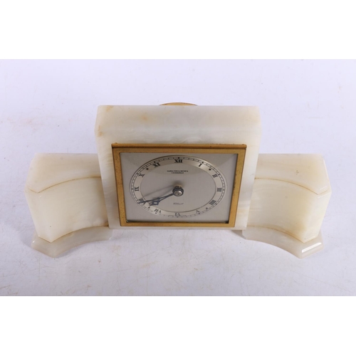 27 - Hamilton & Inches Elliott alabaster mantle clock in the Art Deco style, 26cm long.