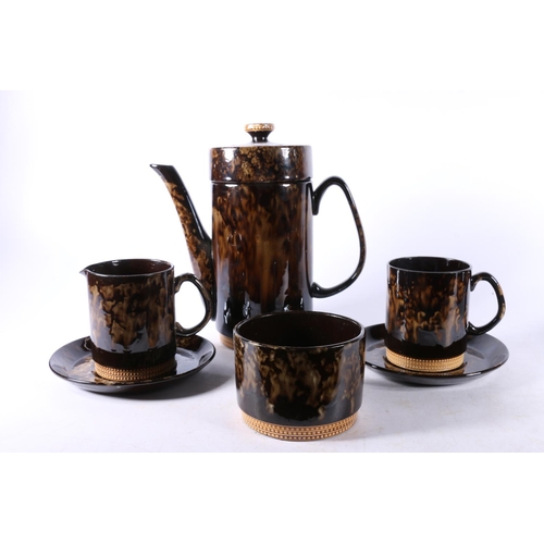 30 - English pottery coffee set decorated with mottled treacle style glaze, stamped made in England to ba... 