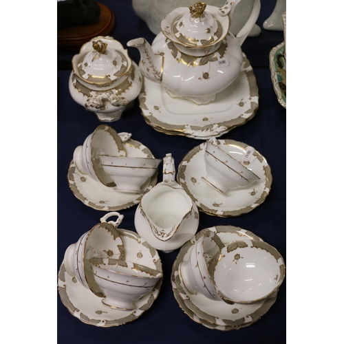 65 - 19th century Rockingham style porcelain teaset with gilt decoration.