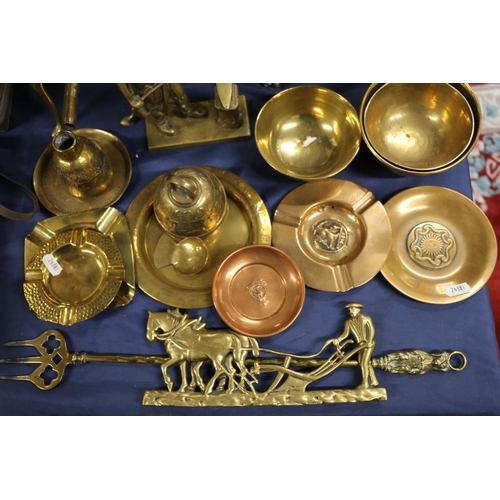 68 - Brass ware to include an amber style handled coffee pot, a kettle, a jardinière, a double tri... 