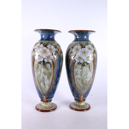 81 - Two Royal Doulton vases of baluster form, with floral decoration, 28cm high.