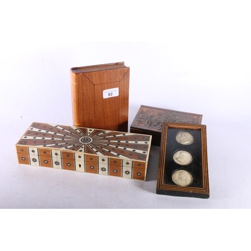 82 - Inlaid box with sunburst style top, 6cm x 28cm x 10cm, another box in the form of a book, three repr... 