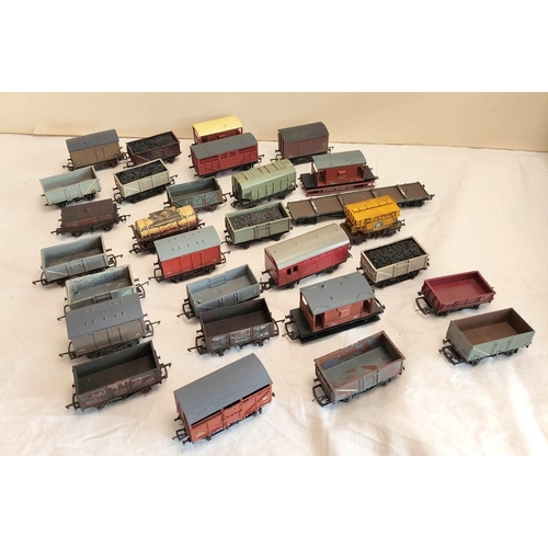 126 - Collection of 00 gauge rolling stock covered goods wagons and trucks, to include examples by Hornby,... 