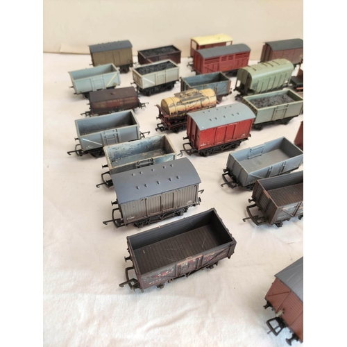 126 - Collection of 00 gauge rolling stock covered goods wagons and trucks, to include examples by Hornby,... 