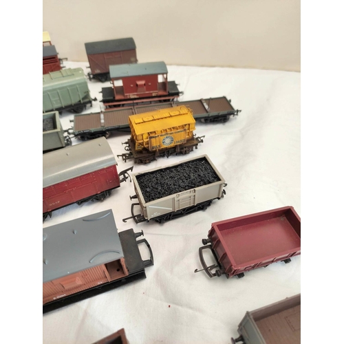 126 - Collection of 00 gauge rolling stock covered goods wagons and trucks, to include examples by Hornby,... 