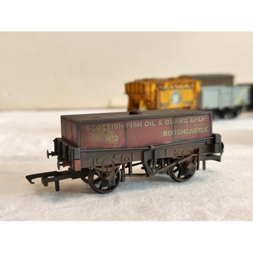 126 - Collection of 00 gauge rolling stock covered goods wagons and trucks, to include examples by Hornby,... 