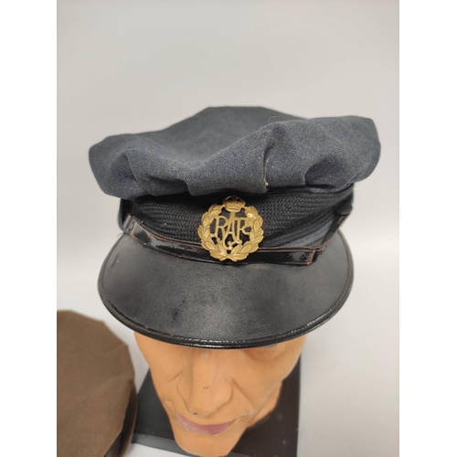 220 - Two military soft caps to include a WW2 era RAF cap and a khaki cap bearing W.R.A.C badge. (2)