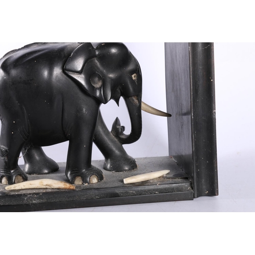 110 - Ebony elephant bookends, 18cm high.