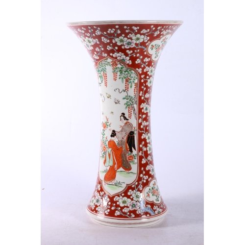 111 - Chinese vase of waisted form with flared rim, two panels on prunus ground, 30cm high.