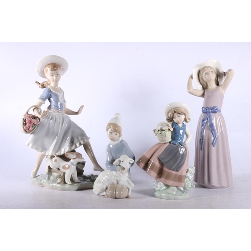 162 - Four Lladro figurines to include Lady with a basket of flowers and a dog, another lady with flowers,... 