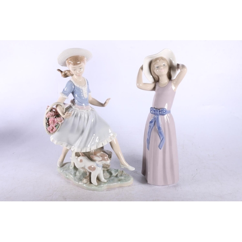 162 - Four Lladro figurines to include Lady with a basket of flowers and a dog, another lady with flowers,... 