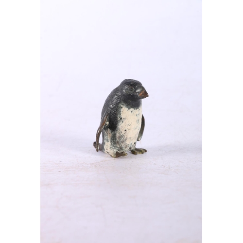 194 - Cast metal figure of a penguin.