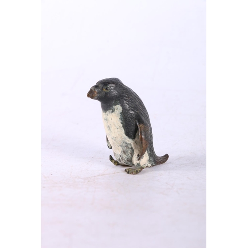 194 - Cast metal figure of a penguin.