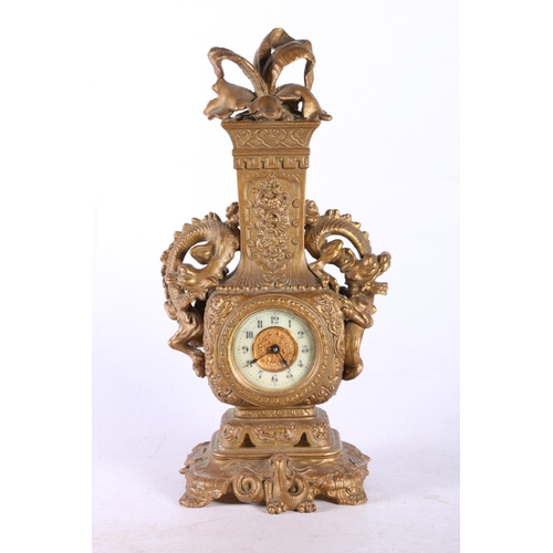 195 - Oriental bronzed table clock with dragon design.