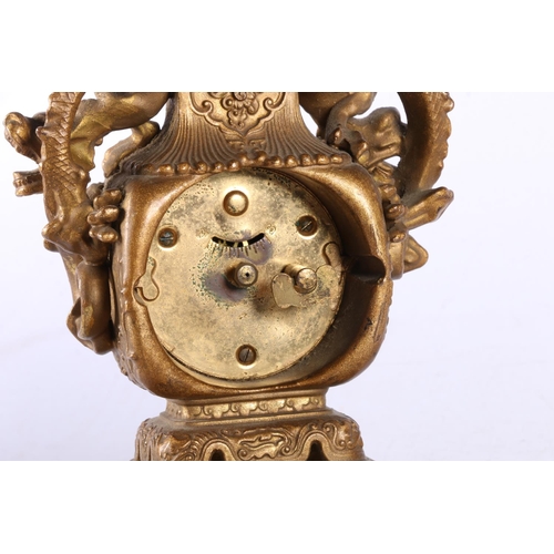 195 - Oriental bronzed table clock with dragon design.