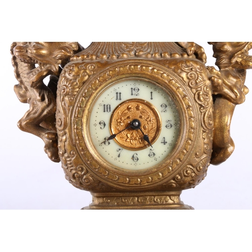 195 - Oriental bronzed table clock with dragon design.