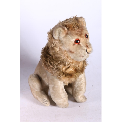 287 - Vintage toy dog, 26cm high, and a lion.