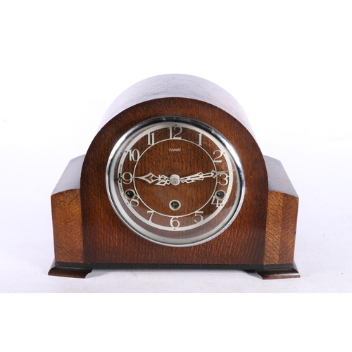 306 - Enfield oak mantel clock, 23cm high.