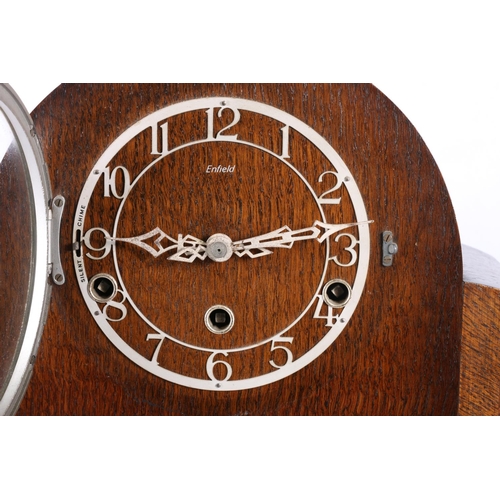 306 - Enfield oak mantel clock, 23cm high.