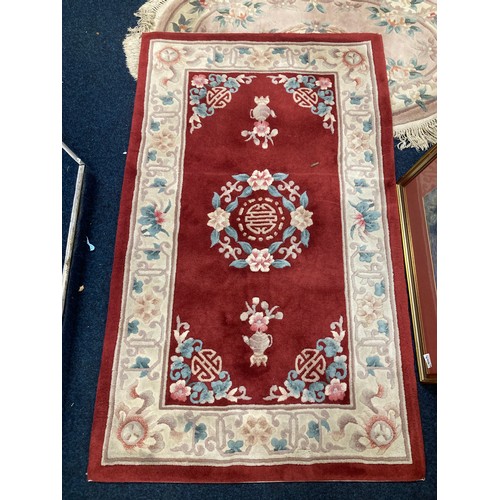 712 - Three Chinese rugs, largest 188cm x 93cm.