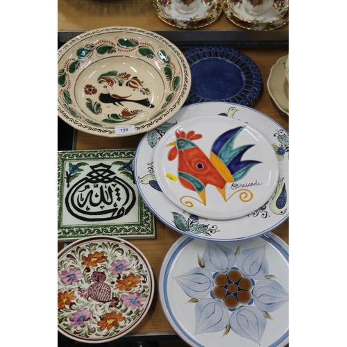 128 - Ceramics to include plates, bowls, a tile, etc.