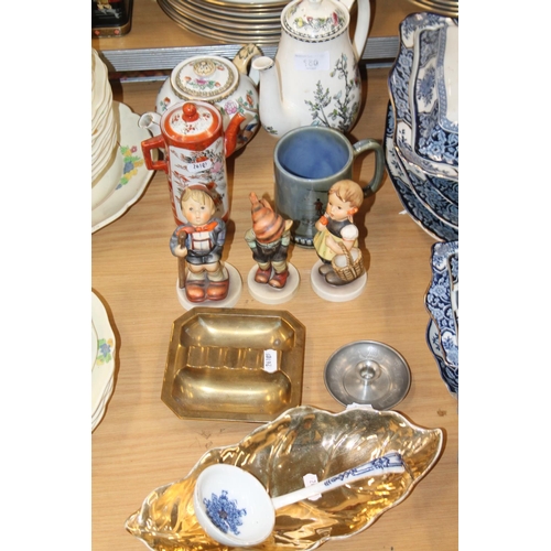 130 - Ceramics to include a teapot, a coffee pot, Hummel figures, a metal ashtray, etc.