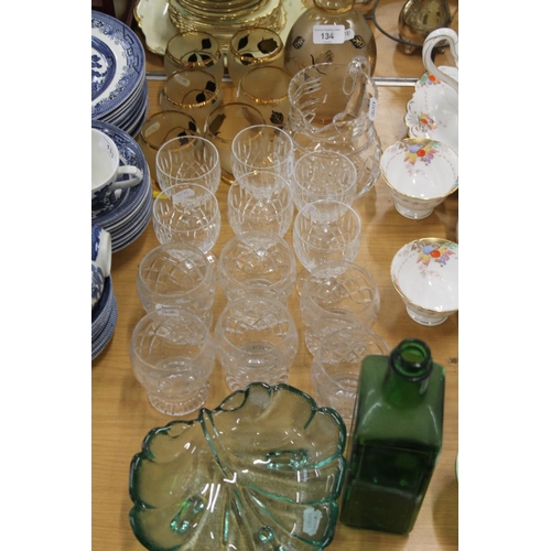 134 - Glass ware to include a decanter, 26cm, glasses, stemware, a water jug, etc.