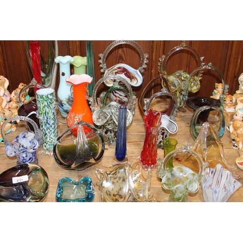 231 - Art Glass to include baskets, an end of day vase, an ashtray, bud vases, and a latticino glass handk... 