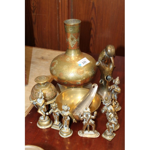 299 - Brass to include a vase, an elephant clock, bell, Southeast Asian deities, etc.