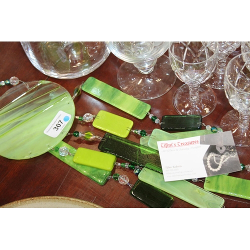 307 - Glass to include champagne flutes, a water jug, a pair of table ornaments, a wind chime, etc.