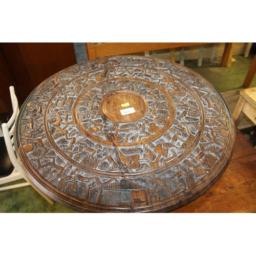 670 - African carved tabletop, 61cm diameter.