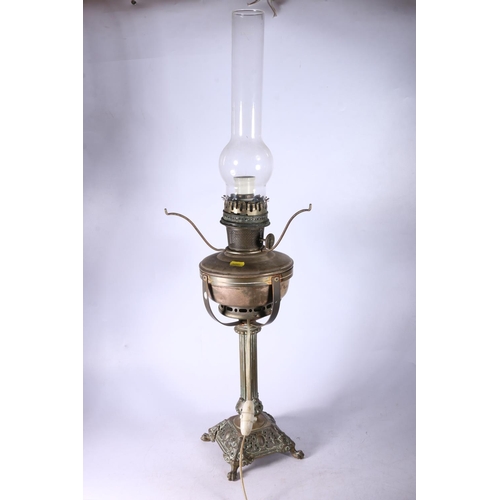 101 - Converted oil lamp, marked Aladdin, on pierced base with paw feet, 75cm to top of shade.