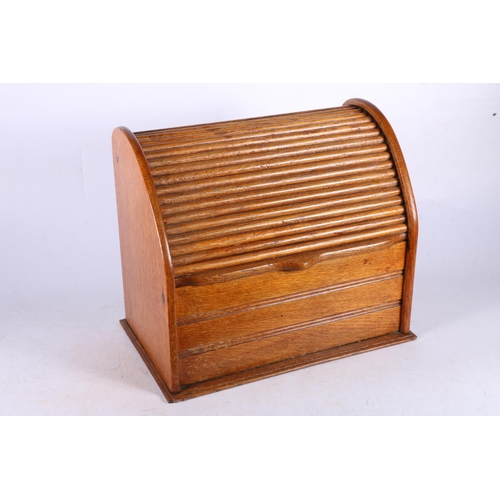 102 - Oak stationery box with tambour front, 24cm high.