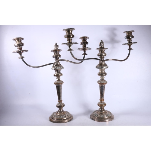 109 - Pair of silver-plated candelabra, 48cm high.