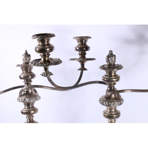 109 - Pair of silver-plated candelabra, 48cm high.